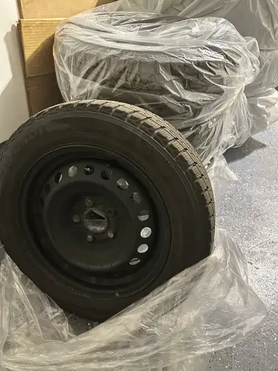 a set of 4 winter tires on rims fit for a nissan sentra