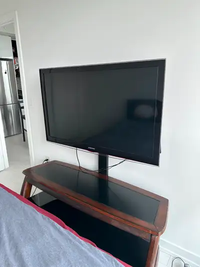 50-inch Samsung TV with TV stand and mount included.