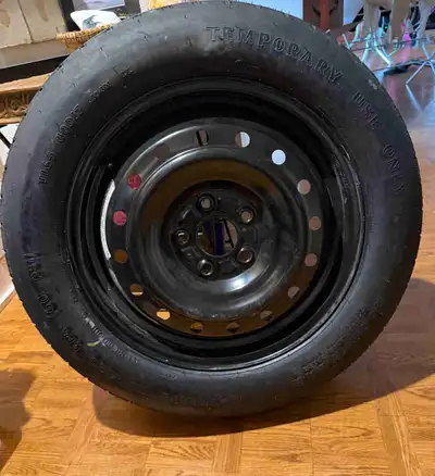 Barely used Goodyear Convenience Spare tire has a size of T165/80D17. This temporary use tire is mou...