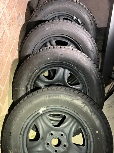 FOR SALE Four (4) snow tires on black rims Bridgestone Blizzak WS90 Size: 215/65R17 From Toyota Coro...