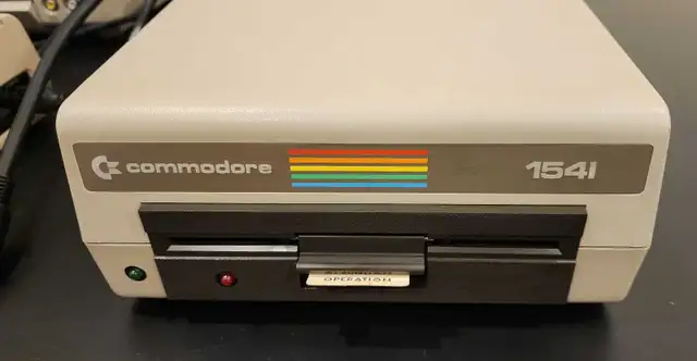 Commodore floppy disk drive 1541 with box and floppy disks in Other in Calgary - Image 3