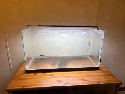 Selling a used 55-gallon aquarium with a Filter Heater, subtrate and a light! It also comes with som...