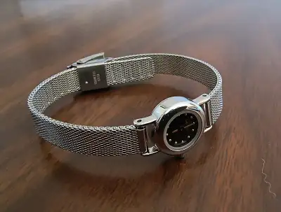 Elegant ladies wristwatch by Skagen Denmark. Features a stainless steel case, mesh bracelet. Delicat...