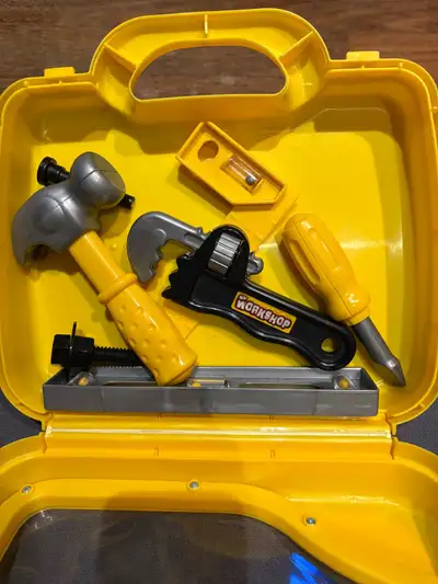This is a children's toy tool set in its original yellow carrying case. Let your little one's imagin...
