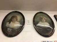 Curved glass with frames of two girls.