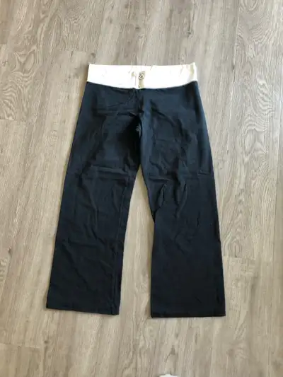 Black with some white Small zipper at front Stretchy Ankle length Size large but fits like a small/m...