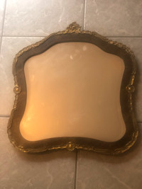 Antique wood & gilded stucco wall mirror.18”x17”.