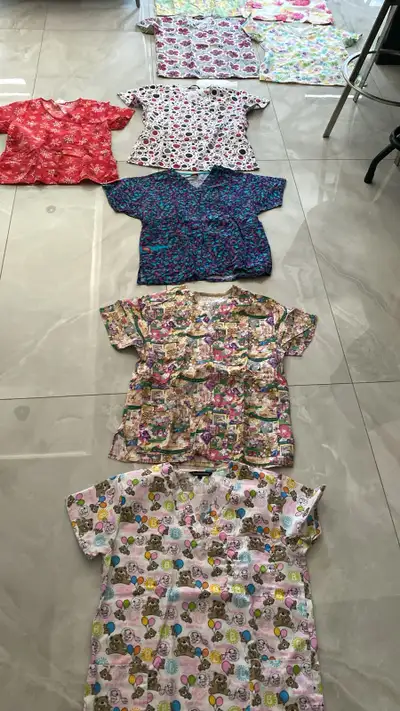Gently used women’s large scrub tops, View more