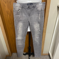Female grey distressed jeans 