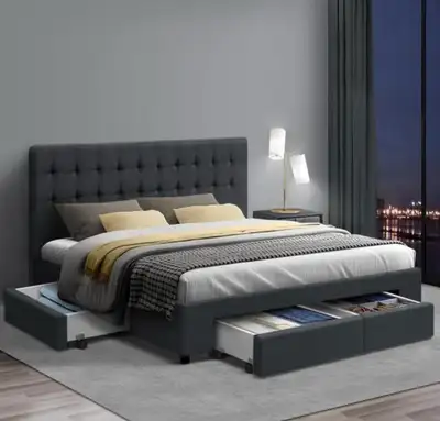 This queen-sized upholstered platform bed features a modern tufted headboard and four integrated pul...