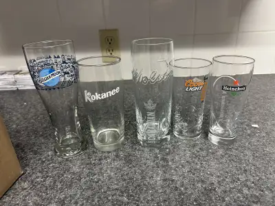 I'm selling a set of five beer glasses, perfect for any home bar or beer enthusiast. This set includ...