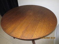 Antique round oak pedestal claw foot dining table