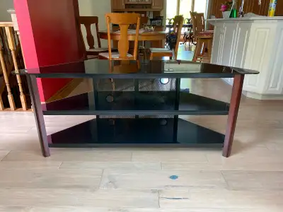 Glass and wood 3 tier stand, holds up to a 65” TV Please call to inquire 519-449-5057