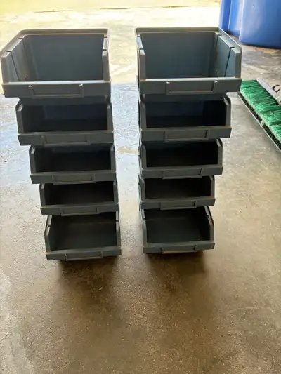 Ten stackable storage bins. 8 are 4”x4” and 2 are 4”x 6”. Ideal for crafts or garage use. GUC.