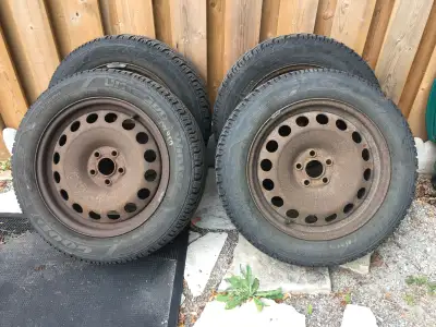 Set of 4 Goodyear Ultra Grip winter tires on 16" steel rims. Like new