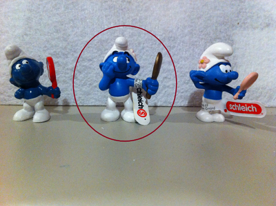This ads shows 3 variants of Beauty (Vanity) Smurf and is offering the one circled in RED. Made in G...