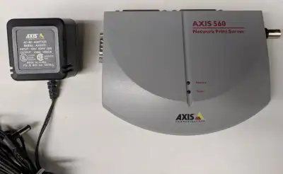 Used item in good working condition. The unit features two parallel ports and two network ports (one...