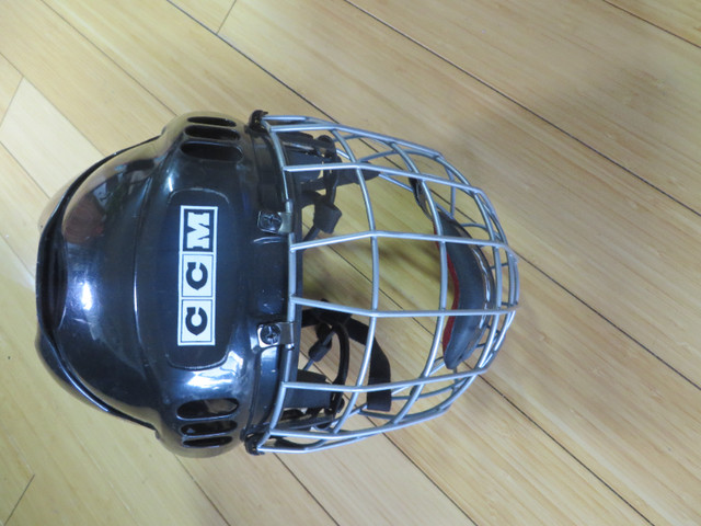 CCM Men's Hockey Helmet with protective cage in Hockey in Lethbridge