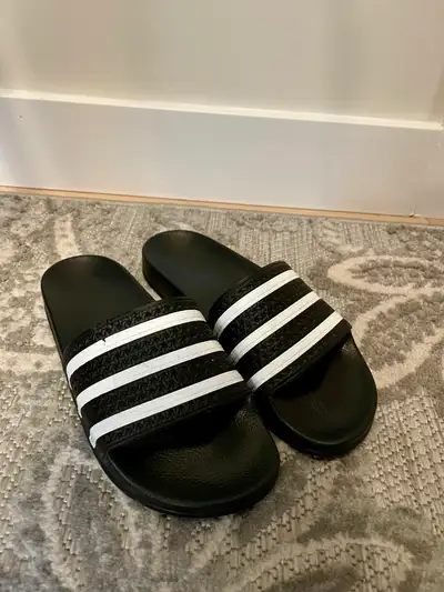 Smooth slip-ons reveal their adidas DNA with signature 3-Stripes. Like new condition, minus a very s...