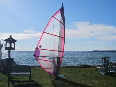wind surf surfer surfing windsurf windsurfer windsurfing sailboard sail board An older sail but mono...