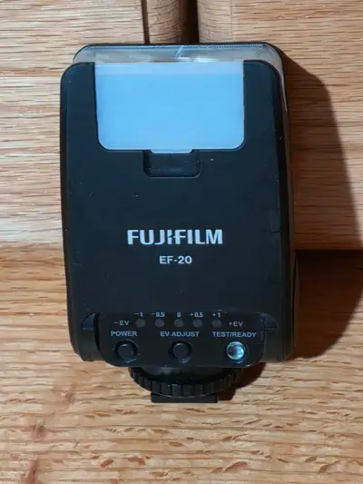 An extremely compact unit, the EF-20 Flash from FUJIFILM is compatible with Fuji cameras featuring T...