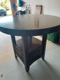 Pub style dining table with extra leaf.