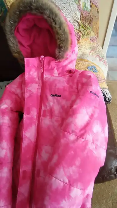 Keep your little one cozy on cold winter days with this flannel lined parka with pockets, name tag c...
