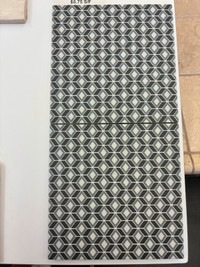 Patterned black, blue and grey tile