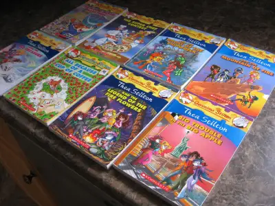 Eight Geronimo Stilton Books. In like new condition. From a smoke free & pet free home. original cos...
