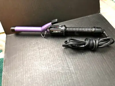 Achieve salon-quality curls effortlessly with this Conair Instant Heat curling iron adding volume an...