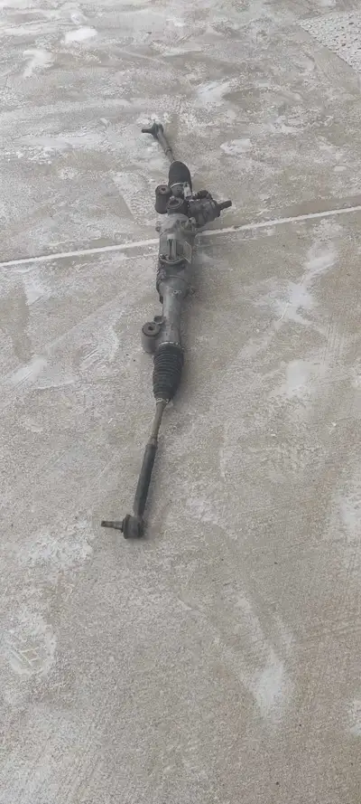 This is a used power steering rack and pinion assembly from a 2008 Lexus RX400h. It's in good workin...