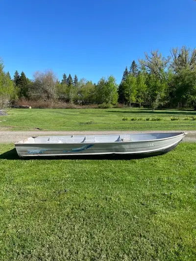 14 ft aluminum Sea Nymph fishing boat and 6hp Johnson outboard with “cruise a day”, hose and seat Pl...