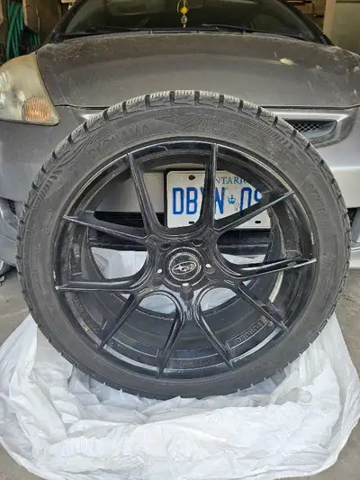 Yokohama Ice Guard 245/40 R18 Comes with 18 inch WRX oem rims Used for 2 winter seasons have damages...
