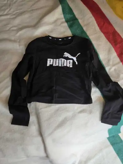 Check out this black Puma long sleeve crop top in a size medium! It's in good condition and ready fo...