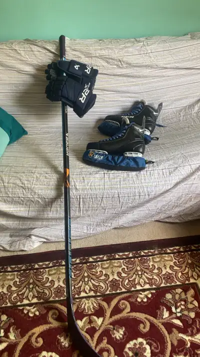 hockey stick gloves and skates, View more