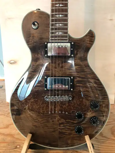 MK solid body electric guitar. I bought it new about four years ago to practice scales (I’m an acous...