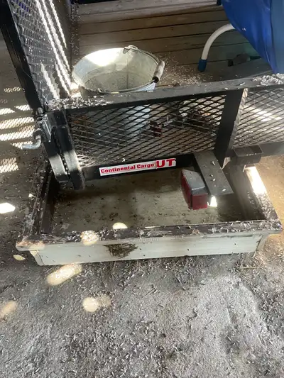 Like new tandem axle utility trailer with drop ramp. Not used for a few years stored inside great fo...