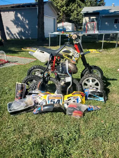 2013 Cobra 50Jr. Comes with dirt bike stand, extra plastics, new piston still in box, extra front an...