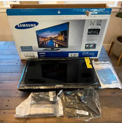 This TV is NEW open box w/remote, stand, power cable, and comes in original box with some extra padd...
