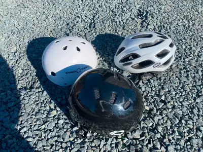 Three bicycles helmets