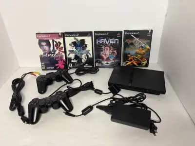 PlayStation 2 PS2 console complete with 2 controllers & 4 games (Haven $12, Soul caliber II $25, Oni...