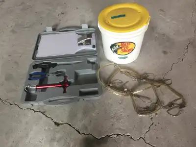 Minnow pail, cleaning kit - scale, knife & board, fish chain.
