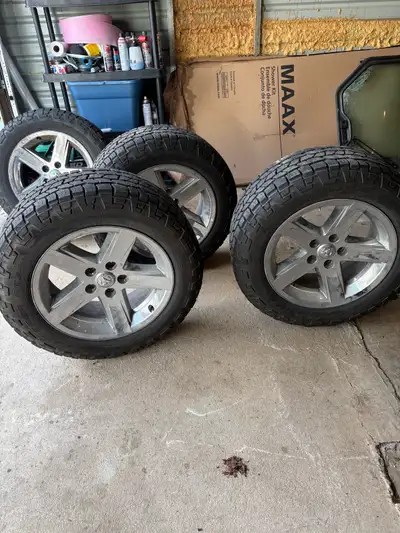 4th generation ram rims and tires 20 inch cooper discoverer 275/60/20 at3 xlt only used a couple of...