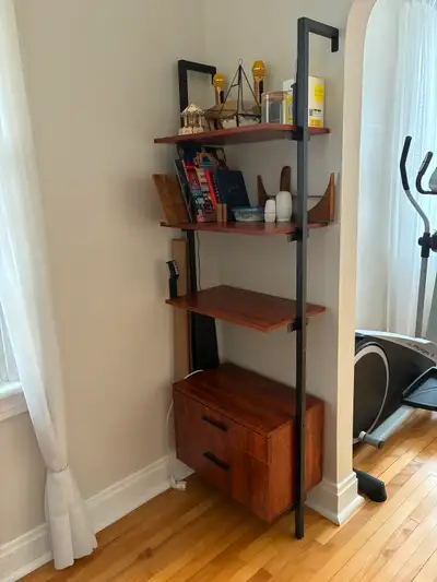 Space saving wall mounted shelving unit with black metal frame, warm wood look shelves and a two dra...