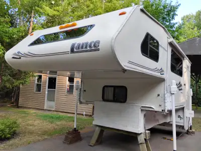 2004 Lance truck camper, Model 1161. Side entry. Immaculate condition. Slide-out dinette, day/ nite...