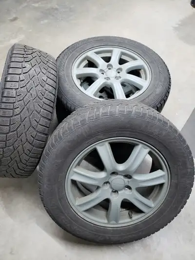 Subaru rims with Nord Frost winter tires, 215/65R16 , 5x100 bolt pattern. Good tread condition thoug...