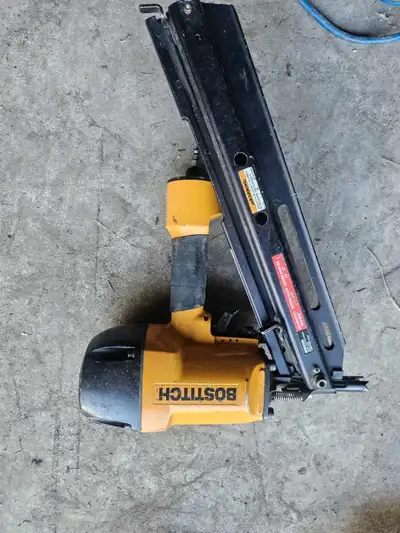 This is a used Bostitch pneumatic nail gun, perfect for framing and other construction tasks. This n...