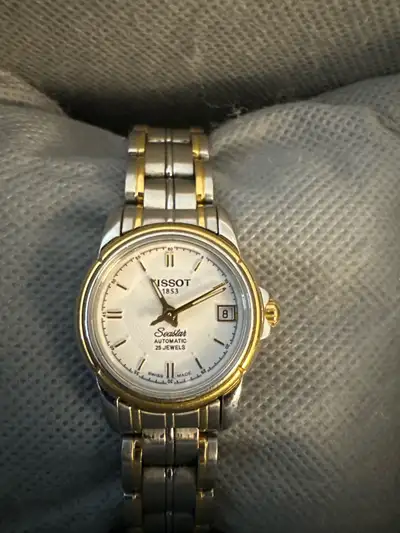 ****NOTE: The stainless steel two tone watch band is only for sale $50 OBO. **** The watch itself wa...