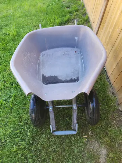 Please read the complete ad before you reply. For sale a Yardworks Double Wheel Wheelbarrow True Tem...