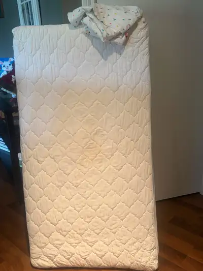 crib mattress, pad and 2 sheets, View more